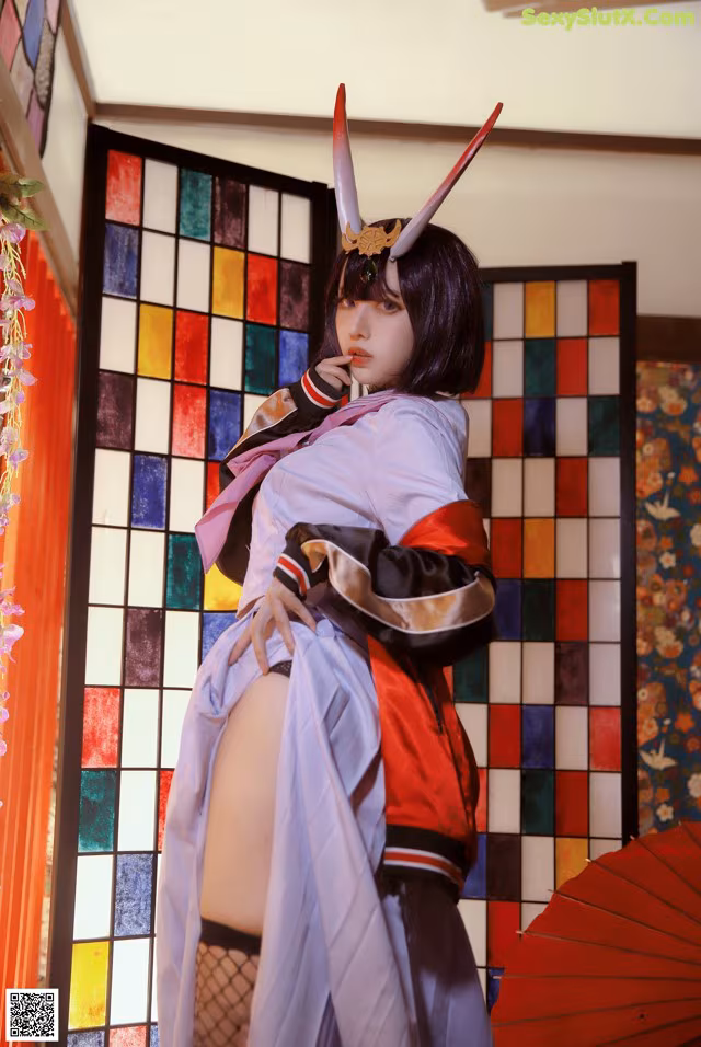 A woman in a kimono is posing for a picture.